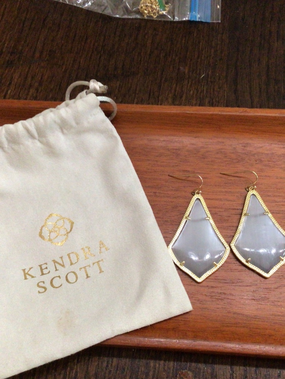 Kendra Scott. Alex dropped earrings with a slate cat’s-eye. Including bag.